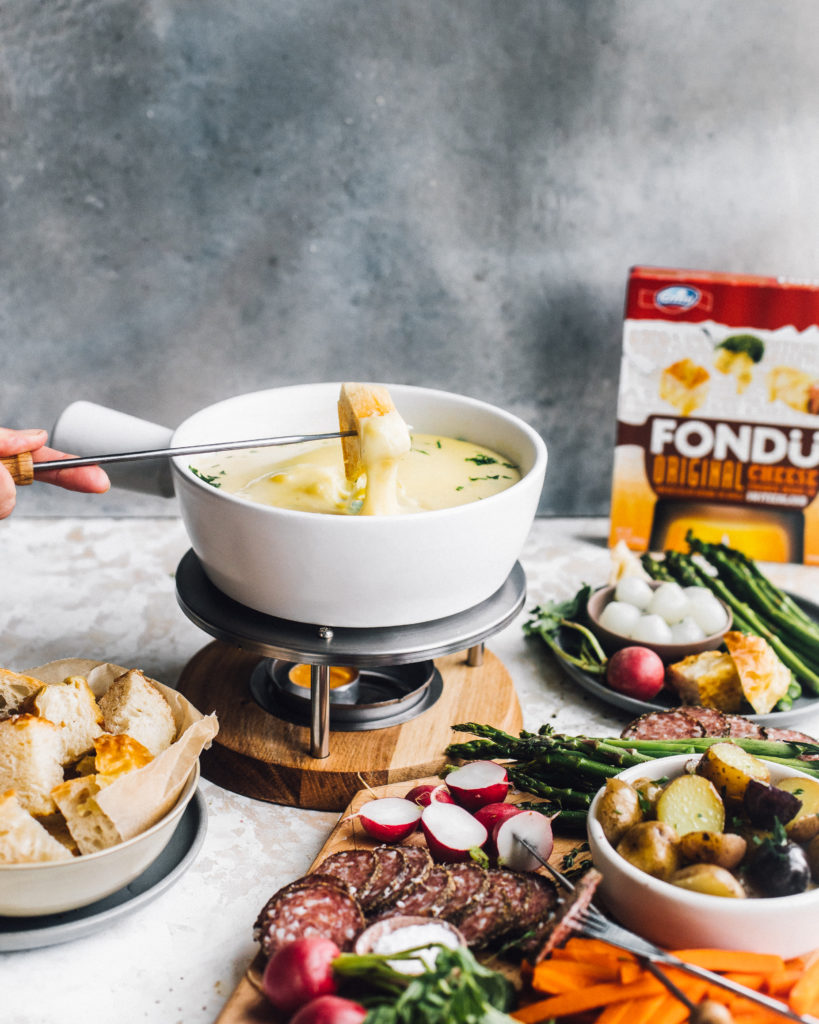 Emmi Fondue spread with vegetables and bread. Emmi Roth